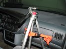 Nylon webbing holding the tripod to the glove compartment door